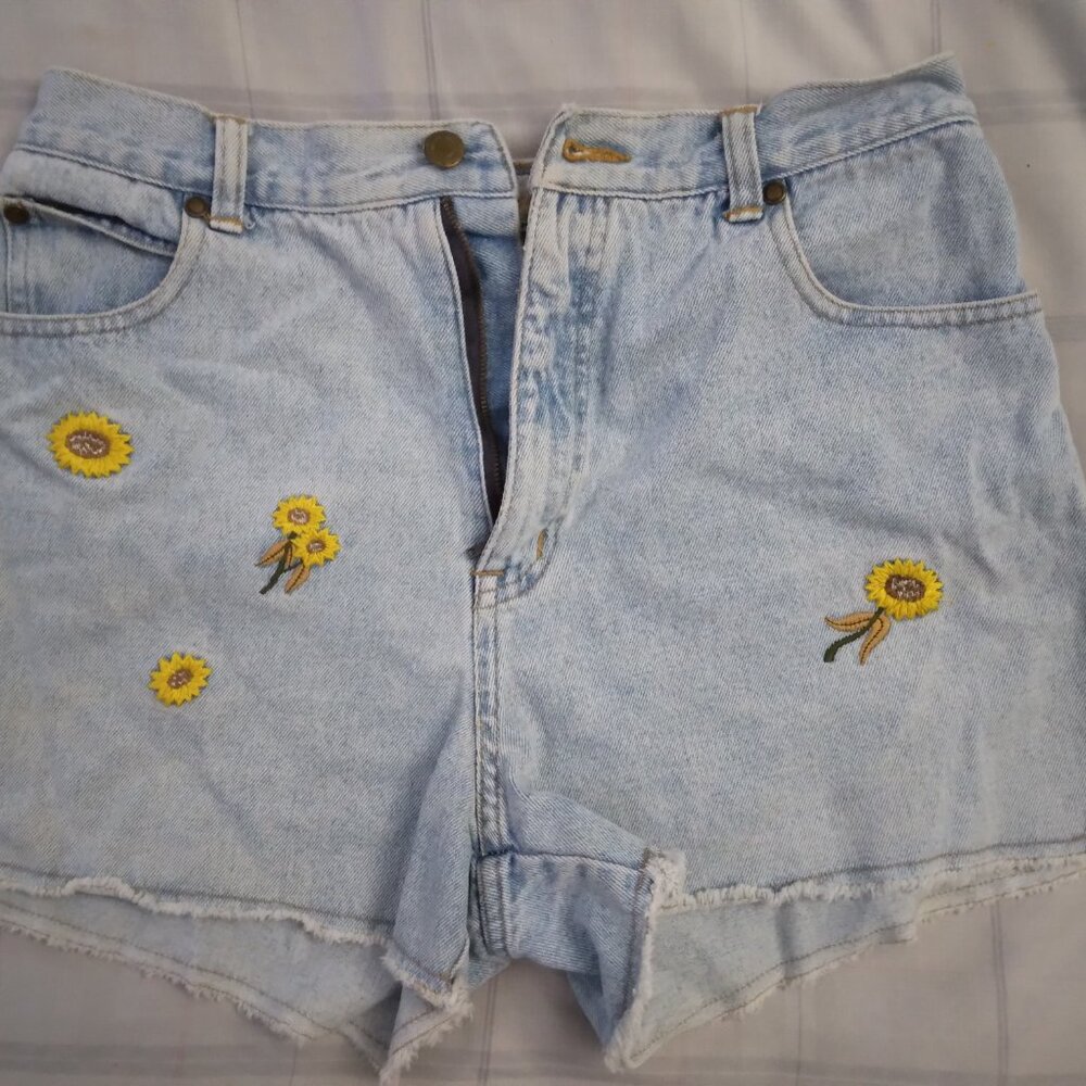 Denim shorts with sunflower decorations